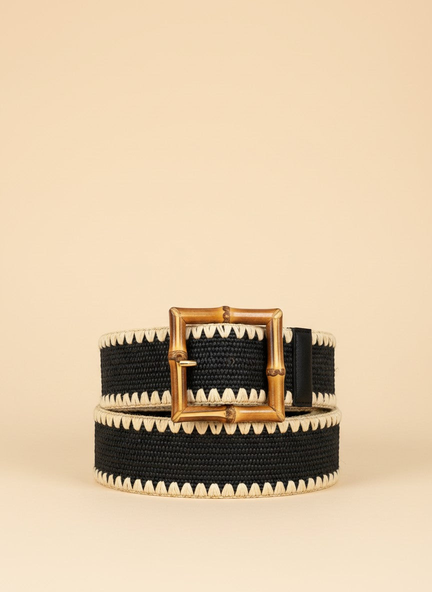 André black woven paper belt with a square bamboo buckle and zigzag trim. Adjustable strap.