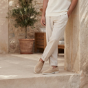 André Clement beige suede loafers for men with white soles. Casual yet elegant.