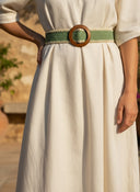 André Oasia kaki woven paper belt with wooden buckle and cream trim. Perfect for dresses and linen trousers.
