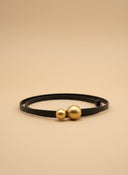 André black leather belt with a distinctive gold double ball buckle. Thin strap, adjustable.