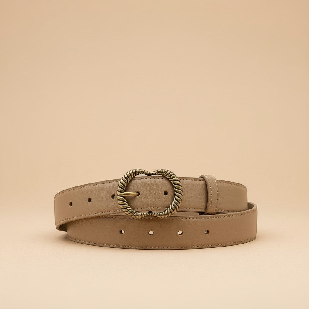 André Zestia beige genuine leather belt with ornate gold heart-shaped buckle. Minimalist design for natural elegance.